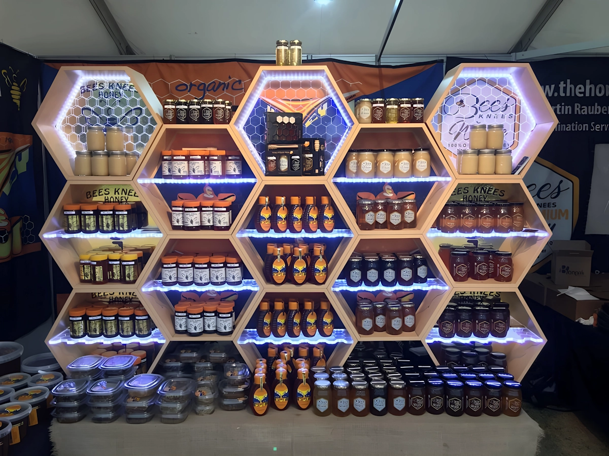 Engraved, illuminated acrylic shelving for honey merchandising