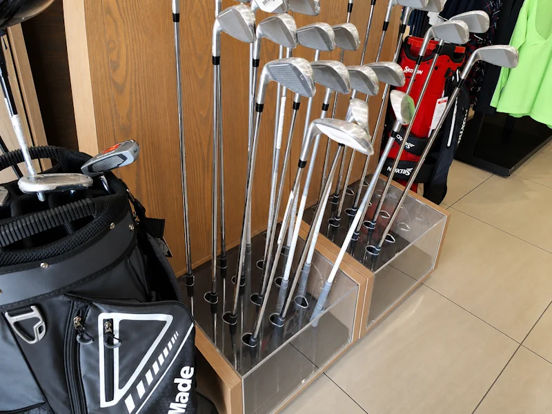 Golf endcap freestanding display unit FSDU with branded acrylic shelving and header — custom retail display stand fabrication Johannesburg South Africa