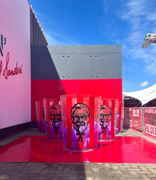 KFC Giant Pong custom acrylic cylinders and game feature for outdoor brand activation at Kentucky Town pop-up event — custom acrylic fabrication Johannesburg South Africa