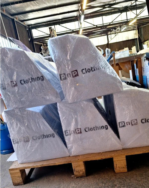 Completed custom acrylic display stands packed and ready for dispatch from Moriah Plastics Johannesburg workshop